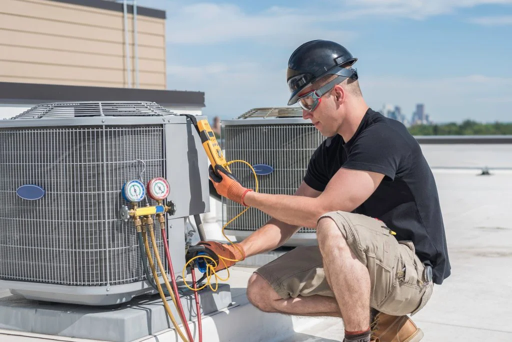 HVAC technician providing heating and cooling services
